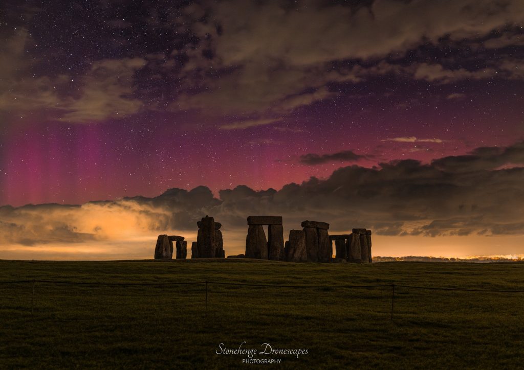 Northern Lights illuminate the sky over Stonehenge