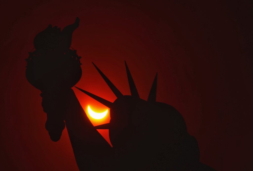 Solar Eclipse And The Statue of Liberty