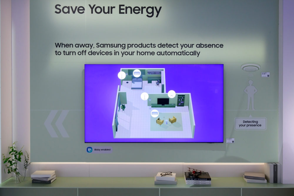 Samsung’s AI Energy Mode detects user movements to activate TV power-saving modes, with additional modes for extended absences. If users are away from home for a long, AI Energy Mode may switch air conditioners to a power-saving setting or turn off power to save energ